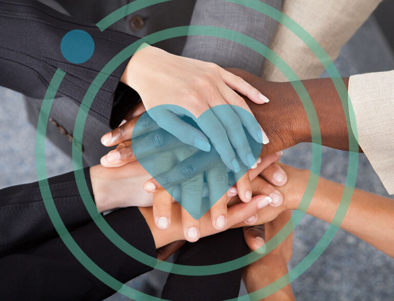 High Angle View Of Multiracial Businesspeople Stacking Hands Over Each Other